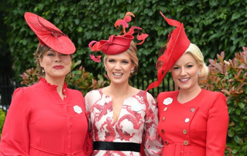 A group of people wearing red and white hat

Description automatically generated