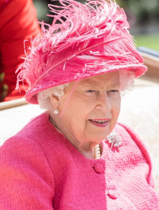 A person wearing a pink hat

Description automatically generated